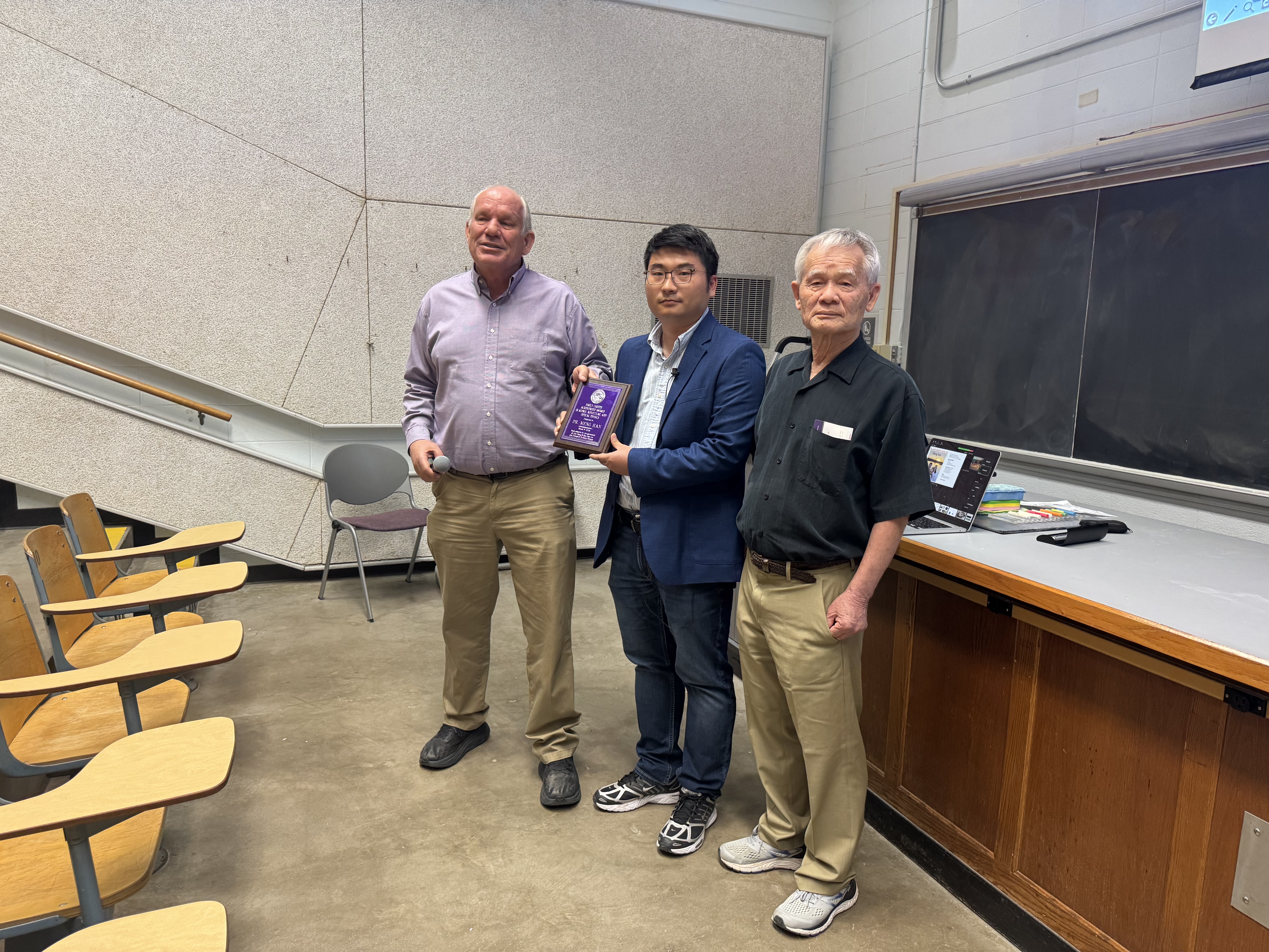 Tim Bolton, head, with Meng Han, recipient, and Distingushed Professor Emeritus Chii-Dong Lin